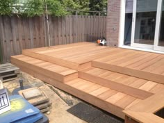 a wooden deck with steps leading up to it