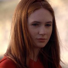 a close up of a person with long hair