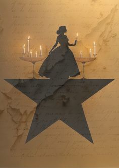 the silhouette of a woman in a dress is on top of a star with candles