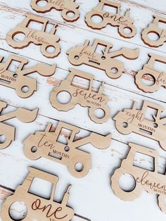 wooden cutouts with the names of different vehicles and numbers on them are arranged in rows