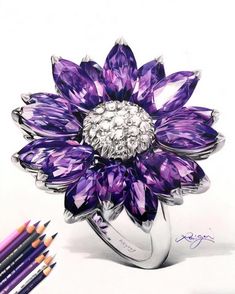 a drawing of a purple flower with diamonds on it and colored pencils next to it