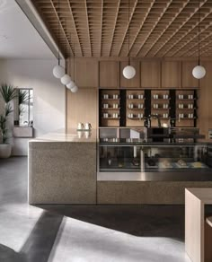 an image of a restaurant setting with food on the counter and lights hanging from the ceiling