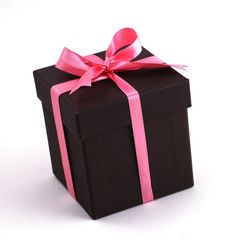 a black gift box with a pink ribbon on it's side and a bow at the top