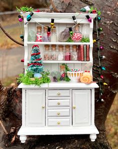 an old china cabinet decorated with christmas decorations