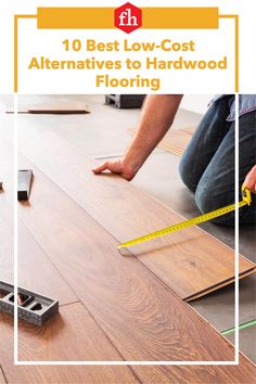 a person measuring the width of hardwood flooring