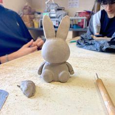 a clay bunny sitting on top of a table