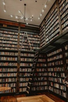 a room filled with lots of books next to a stair case full of books on shelves