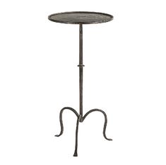 an iron table with a round top