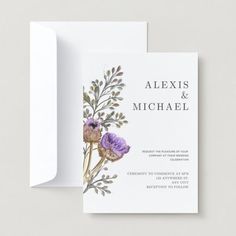 an image of wedding stationery with flowers on the front and back of the card