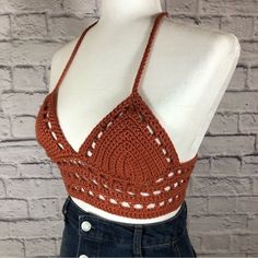 a mannequin wearing a crocheted bralet