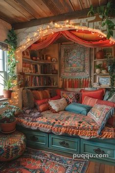 a room with lots of pillows and rugs on the floor