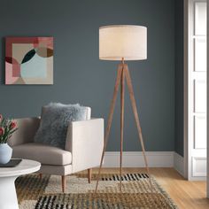 a living room scene with focus on the floor lamp