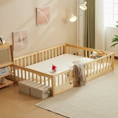 a baby crib in a living room next to a window