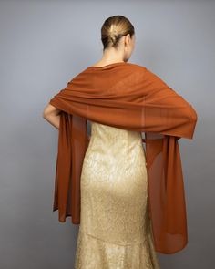 A very elegant and luxury shawl for your wedding dress made of the finest chiffon  Color: burnt orange / cinnamon  Size: 200 x 48 cm (approx.) You can wear it on your shoulders or you can use any brosche to close it. More colors available, please ask. Luxury Shawl, Copper Dress, Orange Accessories, Evening Wrap, Evening Wraps, Faux Fur Wrap, Orange Chiffon, Brown Copper, Chiffon Shawl