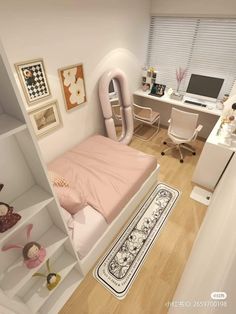 a room with a bed, desk and computer on the wall next to a book shelf