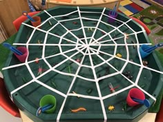 a child's play table with toys on it