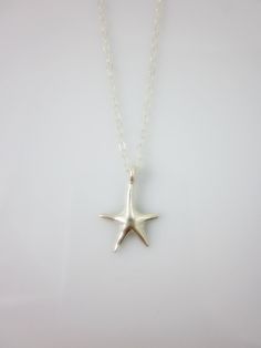 A sterling silver star charm hangs on a dainty sterling silver chain and closes with spring clasp. Simple and chic everyday jewelry. Charm measures: 16 x 10 mm Total length of necklace : 17 inches All components are sterling silver. All items are shipped in a gift box via registered mail. Thanks for looking. Please have a look at more items in the shop: http://smoketabby.etsy.com Sterling Silver Star Charm Necklace Nickel Free, Star-shaped Sterling Silver Jewelry With Lobster Clasp, Sterling Silver Starfish Necklace With Star Charm, Nickel-free Sterling Silver Star Charm Necklace, Sterling Silver Necklace With Starfish Charm, Star-shaped Charm Necklace With Lobster Clasp As Gift, Sterling Silver Starfish Charm Necklace, Sterling Silver Star Charm Necklace For Everyday, Gift Star-shaped Charm Necklace With Lobster Clasp