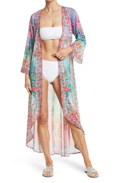 Unleash your free boho spirit in this longline duster styled with vivid allover blooms and airy flare sleeves. V-neckline Flare sleeves All-over pattern Woven 100% polyester Hand wash cold, line dry Imported Model stats: 5'10", 32" bust, 25" waist, 36" hip. Model is wearing size One Size. V-neck Floral Print Festival Cover-up, Long Multicolor Boho Print Cover-up, Multicolor Long Boho Print Cover-up, Spring Floral Print Cover-up With Kimono Sleeves, Flowy Hippie Cover-up, Spring V-neck Beachwear Kimono, Bohemian Multicolor Open Front Cover-up, Bohemian V-neck Cover-up, Spring V-neck Kimono Beach Cover-up