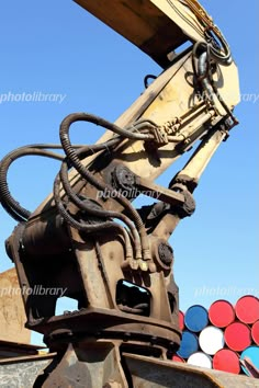 the back end of a crane with lots of balls in the background