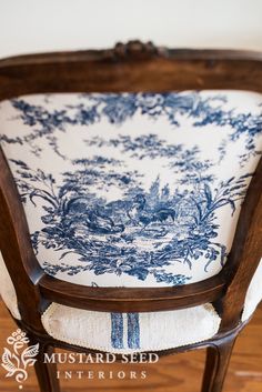 a chair with blue and white fabric on it