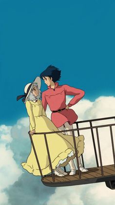 two people standing on top of a metal railing in the air with clouds behind them