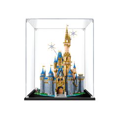 a glass case that has a castle in it on top of a white surface with gold and blue decorations