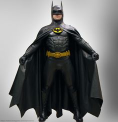 the batman action figure is posed on display