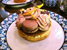 a plate topped with two cakes covered in frosting