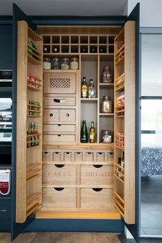 an open pantry filled with lots of bottles