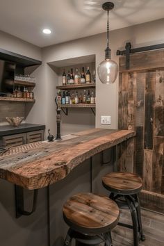 a bar with stools and bottles on the shelves