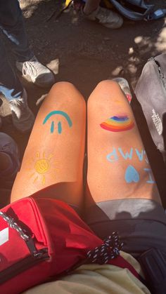 two people with sun and moon tattoos on their legs, both showing the same color