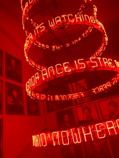 a red room filled with neon lights and pictures