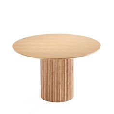 a round wooden table sitting on top of a white floor