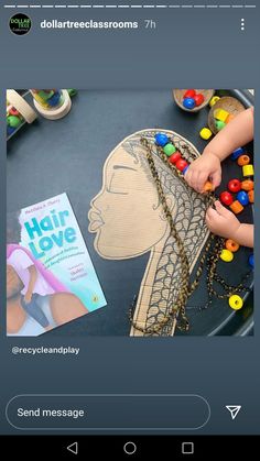 a child is playing with some beads on her head and the words hair love are in front of it