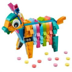 a toy horse made out of legos on a white background