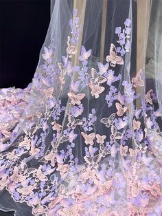 a veil with purple butterflies on it