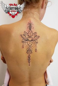 a woman with a tattoo on her back