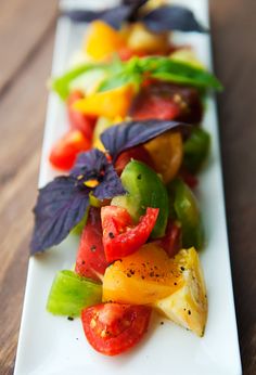 a white plate topped with lots of different types of vegetables