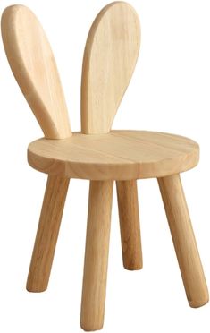 a wooden chair with two legs and a seat that has an animal shaped design on it