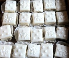 some white chocolates are sitting on top of each other with the word mr and mrs written on them