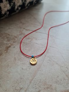 🌙 Handcrafted 14k gold plated dainty adjustable red string necklace 🌙 All materials used are tarnish free and durable 🌙 Best gift for your friends and family or just for yourself 🌙 Regular shipping takes approximately 10-15 business days depending on your country. Express shipping takes 3-5 business days. Please choose express shipping if you want to receive your package faster 🌙 I do offer combined shipping. Please feel free to contact me for custom orders and combined shipping orders 🌙 Although my products are durable and tarnish free, you better keep them away from excessive water and chemicals, perfumes etc. 🌙 For more jewelries don't forget to check my store: https://www.etsy.com/shop/MiniMoonDesign Adjustable Charm Necklaces With Tiny Beads As Gift, Adjustable Tiny Beads Charm Necklace As Gift, Dainty Handmade Adjustable Charm Necklaces, Handmade Dainty Adjustable Charm Necklaces, Adjustable Gold Charm Necklace With Tiny Beads, Handmade Adjustable Dainty Charm Necklaces, Gold Jewelry With Adjustable Cord For Good Luck, Handmade Adjustable Gold Charm Necklaces, Adjustable Handmade Gold Charm Necklaces