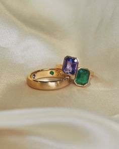 Tanzanite and Emerald bespoke Toi et Moi engagement ring with matching gold band. Engraved and with hidden inner gemstones