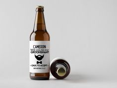 a bottle of beer with a label on it next to a roll of paper that says cannon will you be my groomsman?