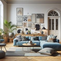 a living room filled with lots of furniture and pictures on the wall above it's windows