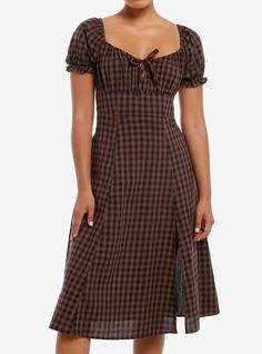 This dress makes us think of a cozy  cool night in a cottage! It's an empire waist midi dress with a black and brown checkered pattern  puff sleeves and a drawstring at the bust. There's a slit on the left side.100% cottonWash cold; dry lowLength: 41"ImportedListed in junior sizesModel is 5'9"Model wears size Small Black And Brown Checkered Dress, Christmas Dress Casual, Brown Gingham Dress, Casual Winter Dresses, Flower Dresses Casual, Black Summer Dresses, Fall Dresses Casual, Layering Dresses, Plaid Dress Outfit