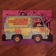 the mystery machine card is sitting on a table