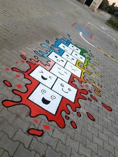 a colorful street art on the side of a road