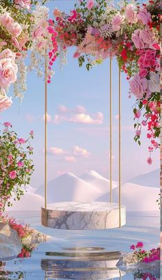 an artistic photo with pink flowers hanging from the ceiling and water in the foreground