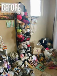 a room filled with lots of yarn and crochet items next to a window