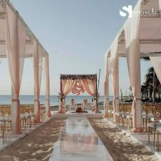 an outdoor wedding set up on the beach